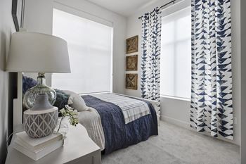 Bedroom with window and curtains